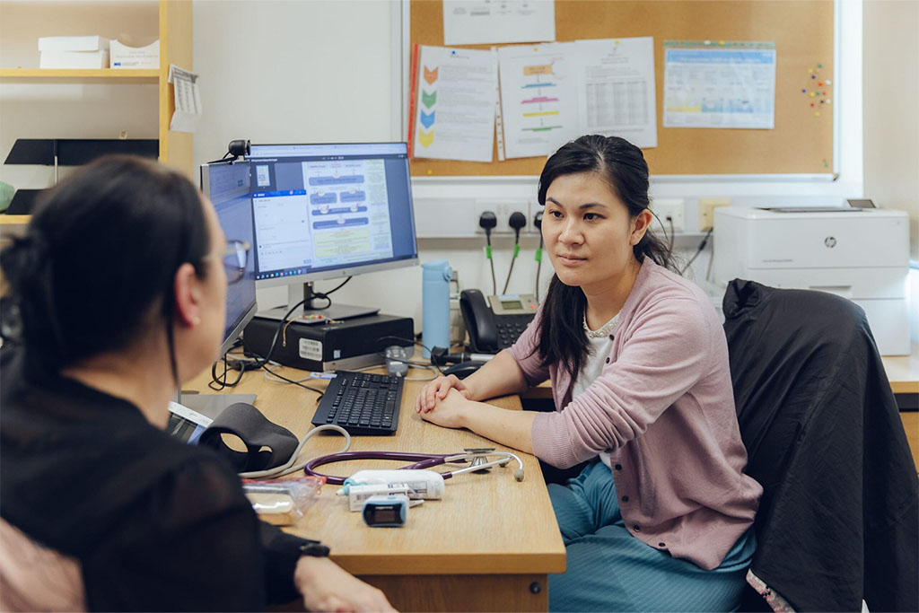 Female GP speaking to a patient